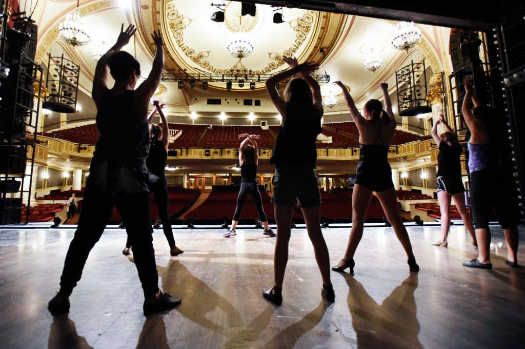 Students stretch under the direction of Laura Sheehy from Cabaret during a Broadway Master Class at Proctors Friday, May 12, 2017.
