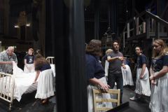 Broadway Camp director Steven Yuhasz, left, and choreographer Freddy Ramirez work wth students in the staging of Les Miserables on the MainStage at Proctors Frday, July 26, 2019.
